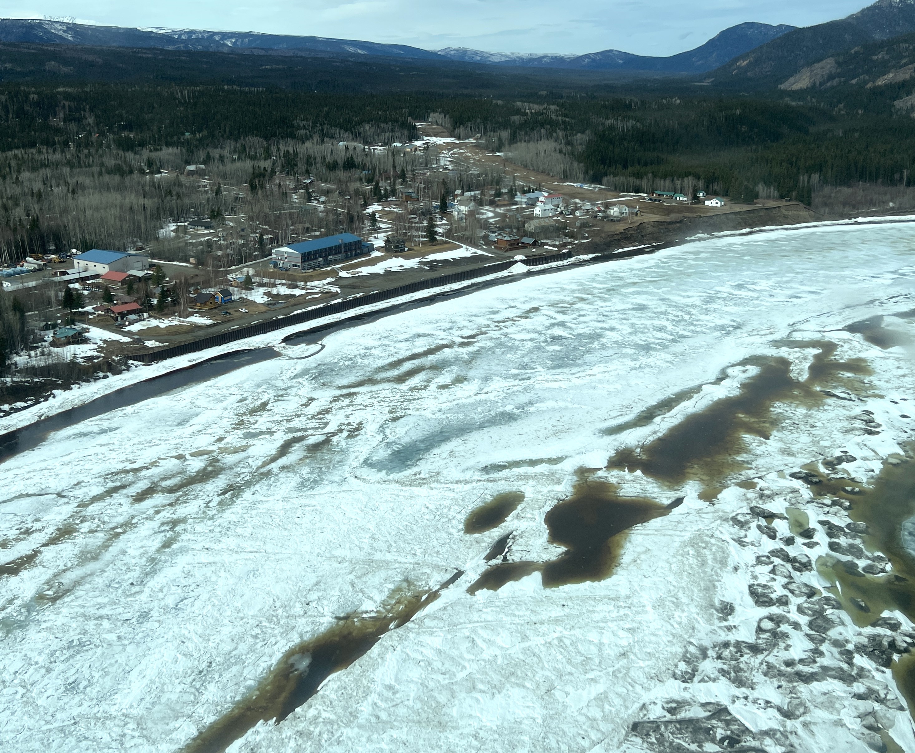 A graphic from the National Weather Service showing a small community next to an ice-covered river.