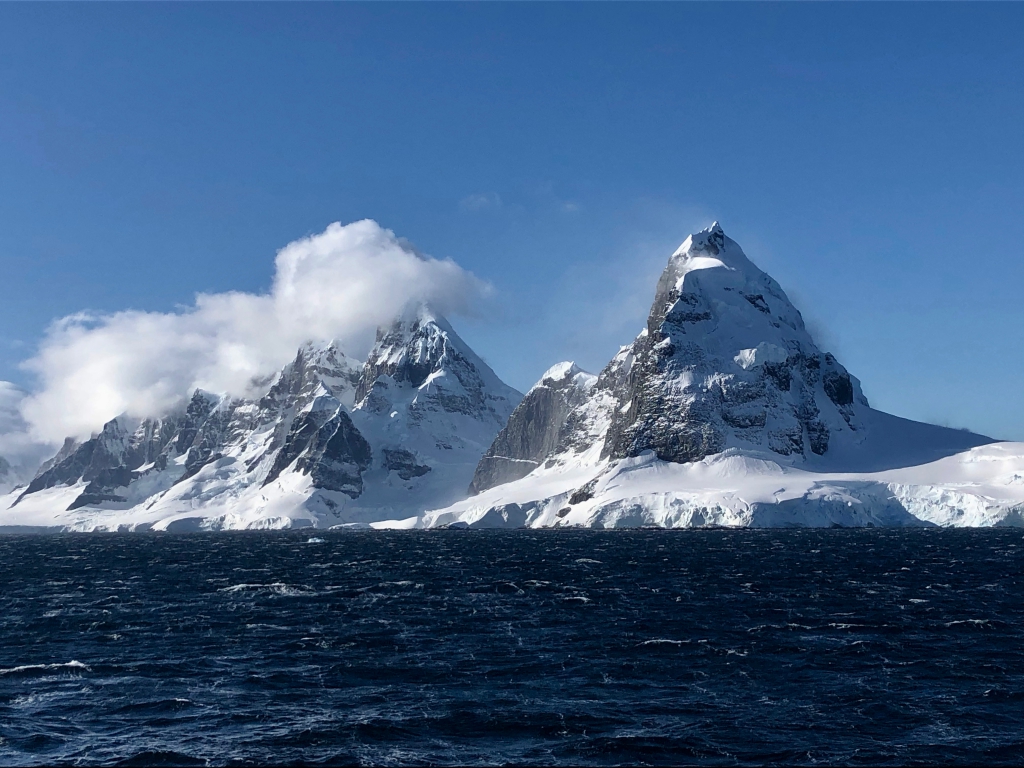 Two massive mountains on Antarctica tower above the landscape. 