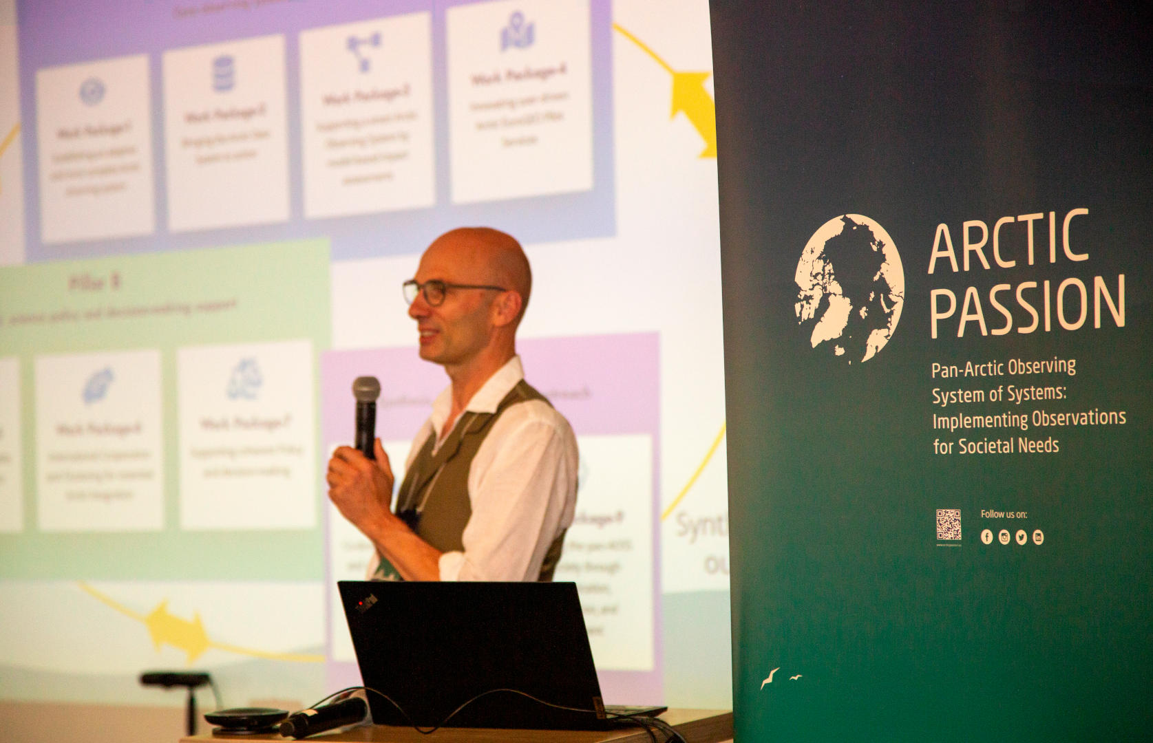 Michael Karcher presents at the 2022 Arctic PASSION General Assembly in Denmark. The Arctic PASSION project is an international, collaborative effort to pilot the SAON ROADS process and a close partner of US AON. Photo credit: Olivia Rempel / GRID-Arendal.